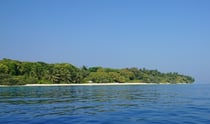 Beach of the Maldivian island resort Soneva Fushi, seen from the direction of the ocean