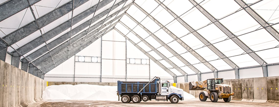trucks in salt storage building