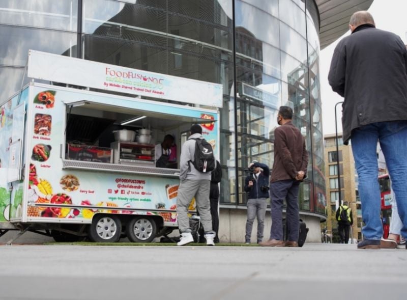 Food Fusion street food trailer serving customers