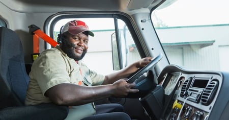 african american truck driver behind wheel