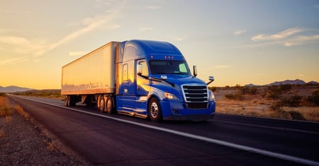 truck driving at sunset