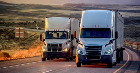 white trucks on road