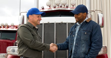 truck drivers shaking hands