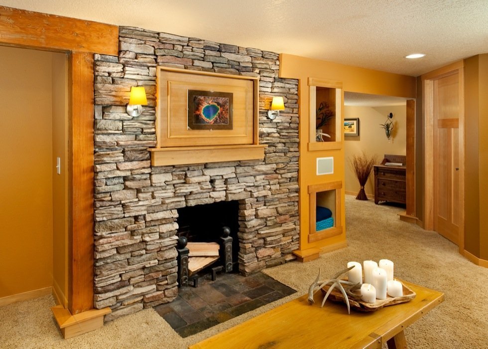 https://fs.hubspotusercontent00.net/hubfs/20490406/Imported_Blog_Media/Contemporary-Basement-Fireplace-with-Natural-Stone-Tile-Surround-and-Built-in-Hearth-and-Shelving-1-1.jpg