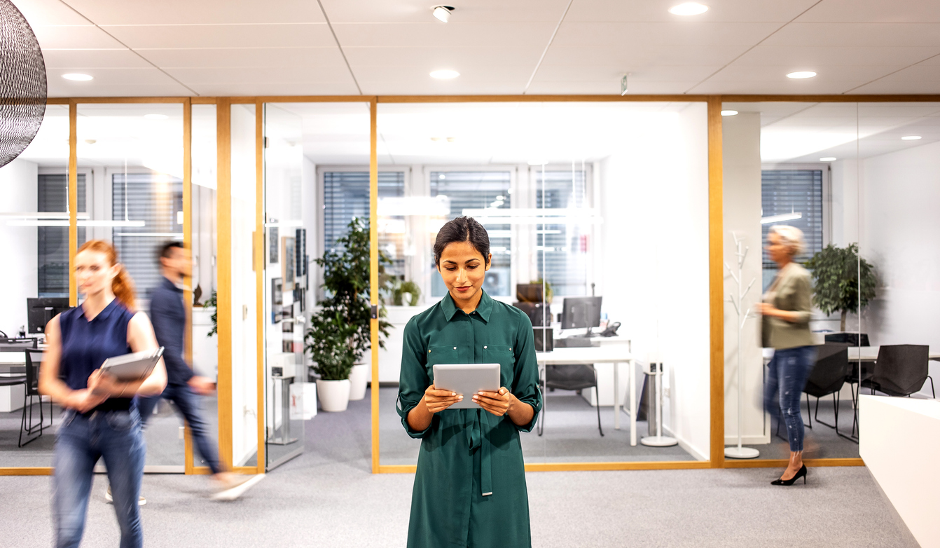 employee reviewing office space utilization data to make impactful decisions 