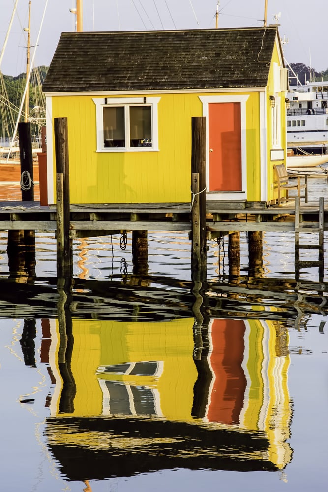 Local color Wharf reflections at sunrise in New England