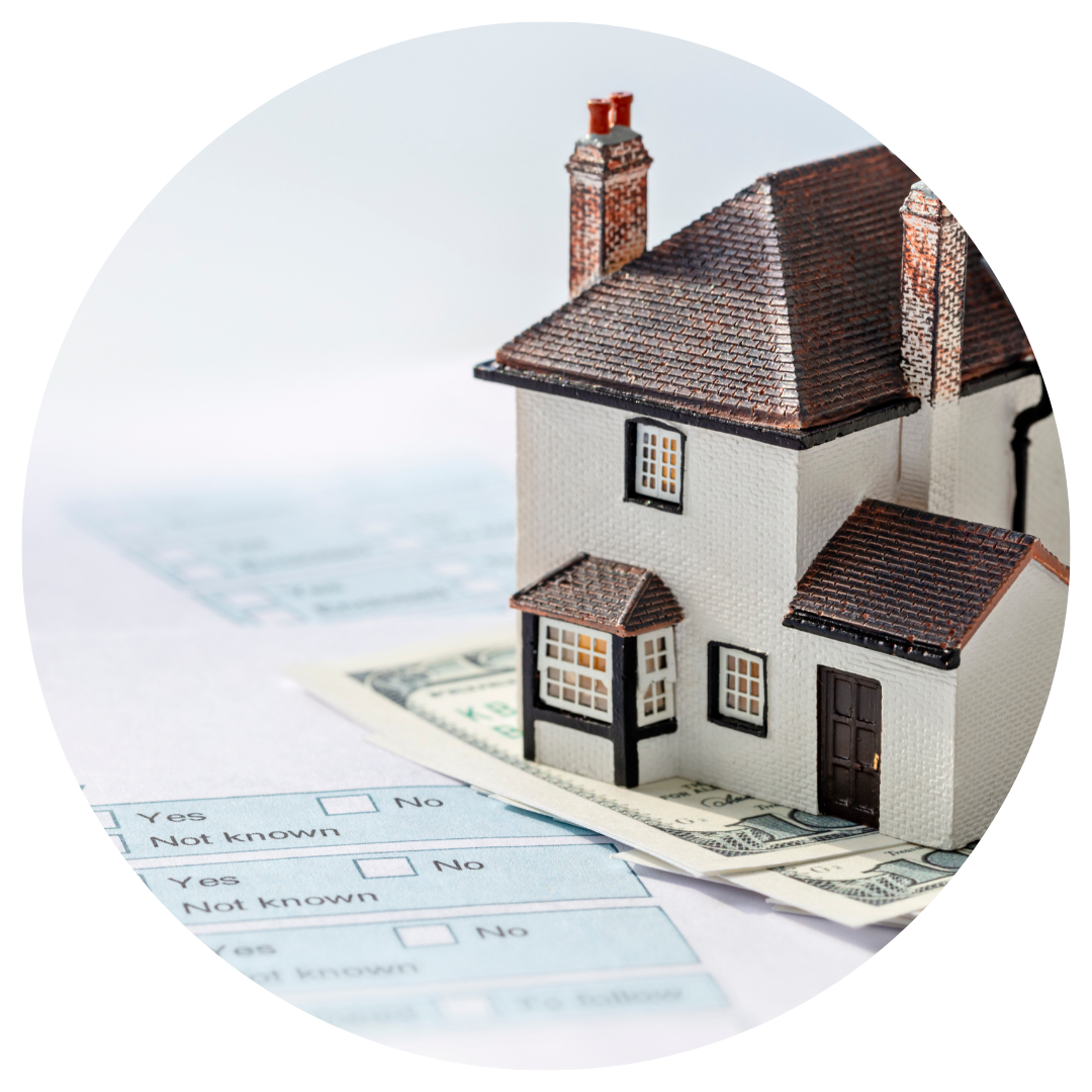 small house on money and paperwork