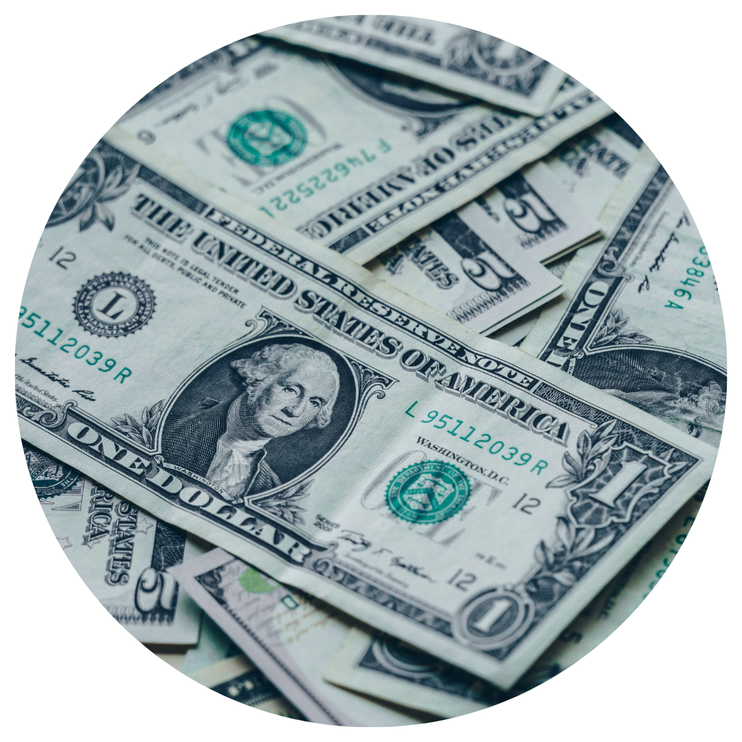 united states dollar bills in a pile on a table