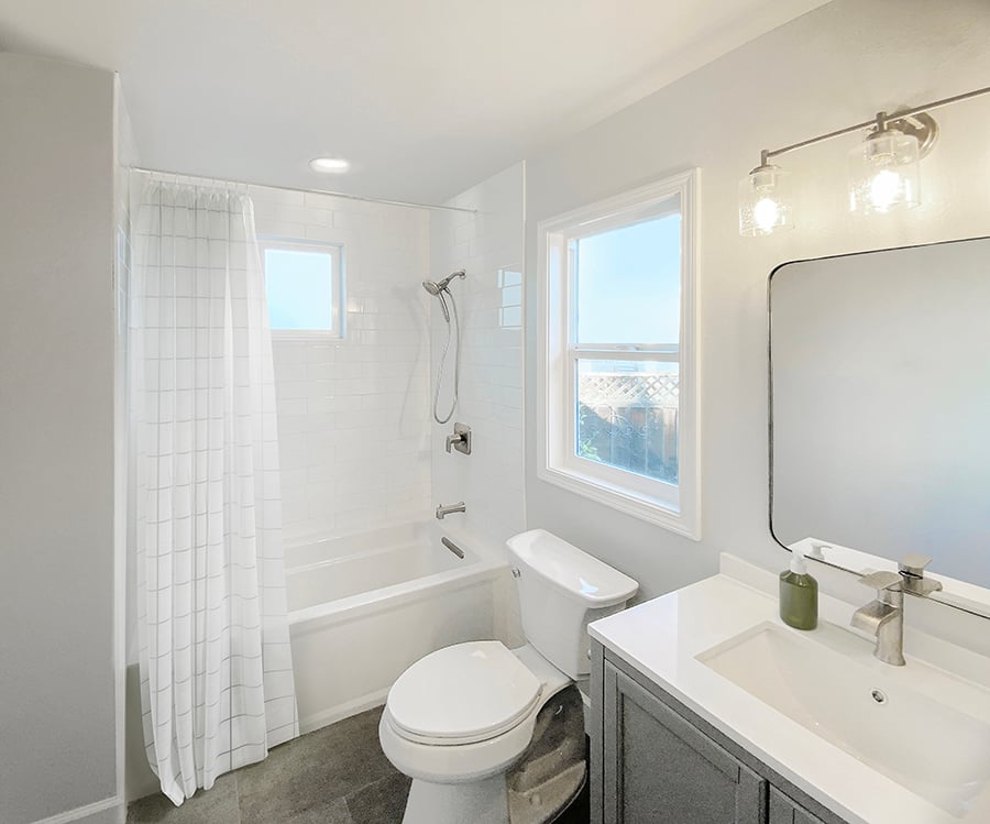 The full bathroom also houses a washer and dryer closet to make the unit entirely self-sufficient.