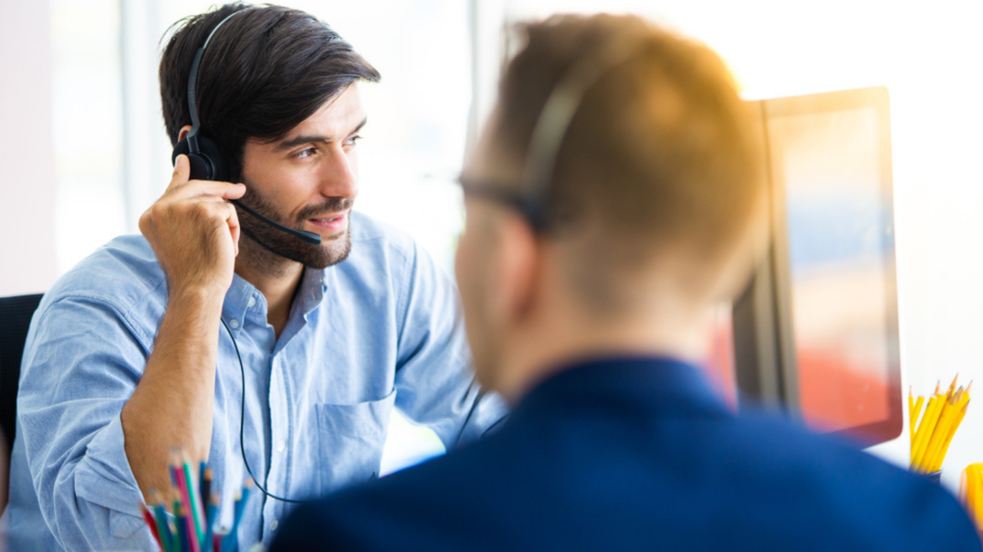 Man with headphones working related to Staff Augmentation-1